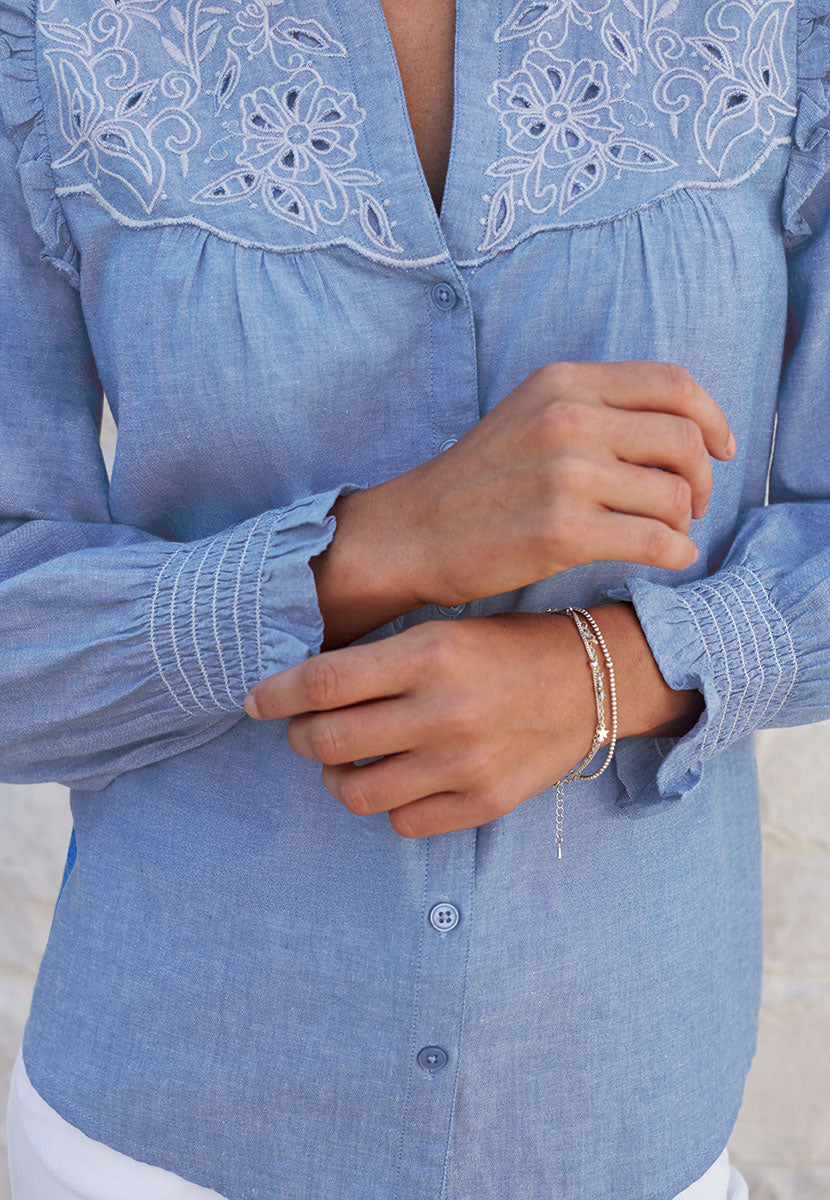 Betsy Long Sleeve Open Notch Frill Neck Cotton Blouse - Chambray Blue Deep Smocked Cuffs Button Front with embroidery detailing Front Detail