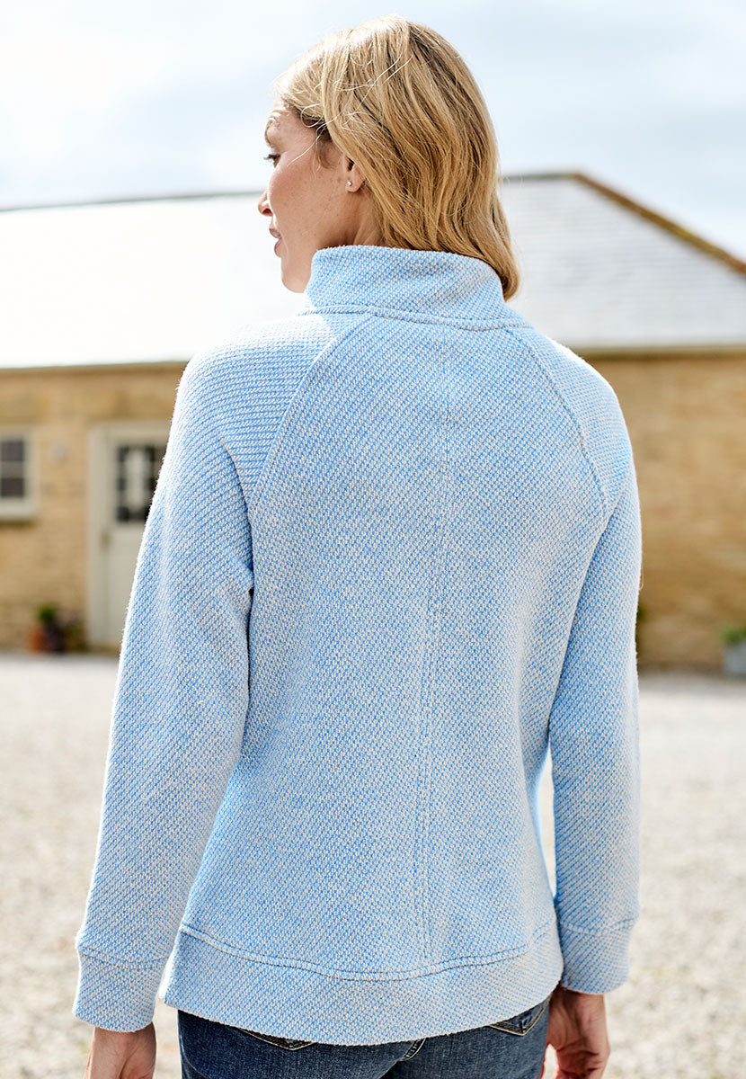 Clara Raglan Sleeve Cosy Sweatshirt - Cornflower Blue Light Blue Textured Outside Brushed Inside Cosy Button-Neck Relaxed Style Jersey with Raglan Sleeves Back View
