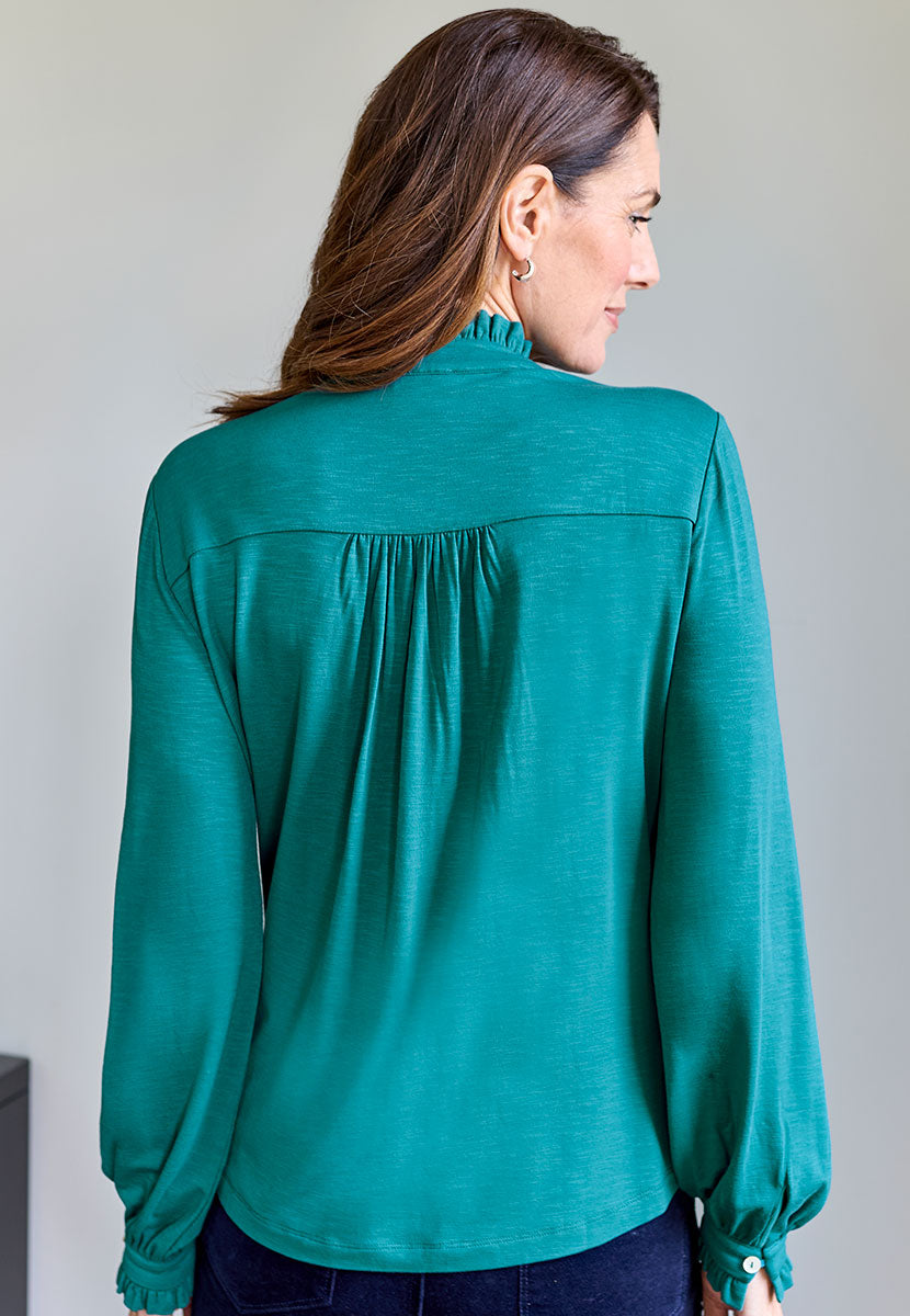 Martine Long Sleeve Collared Jersey Blouse - Teal Green Blue with Open V-Neck Button Through Detail Elasticated Buttoned Cuffs and Ruffle Trims Back View