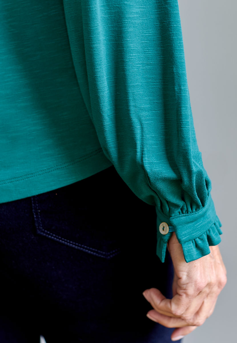 Martine Long Sleeve Collared Jersey Blouse - Teal Green Blue with Open V-Neck Button Through Detail Elasticated Buttoned Cuffs and Ruffle Trims Detail View