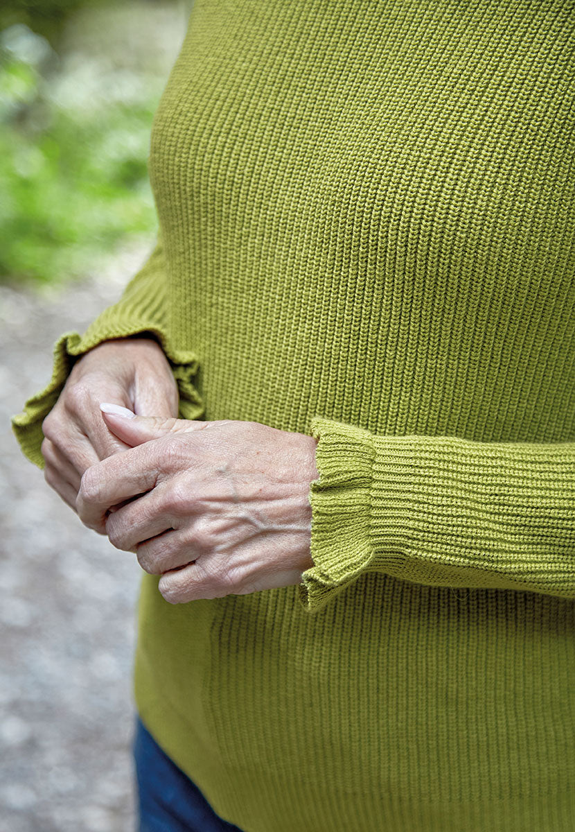 Rosa Relaxed Crew Neck Jumper - Soft Olive Light Green Seasonal Shade Smooth Mid-Weight All-Over Rib Knit with Raglan Sleeves and Frill Cuffs Detail View
